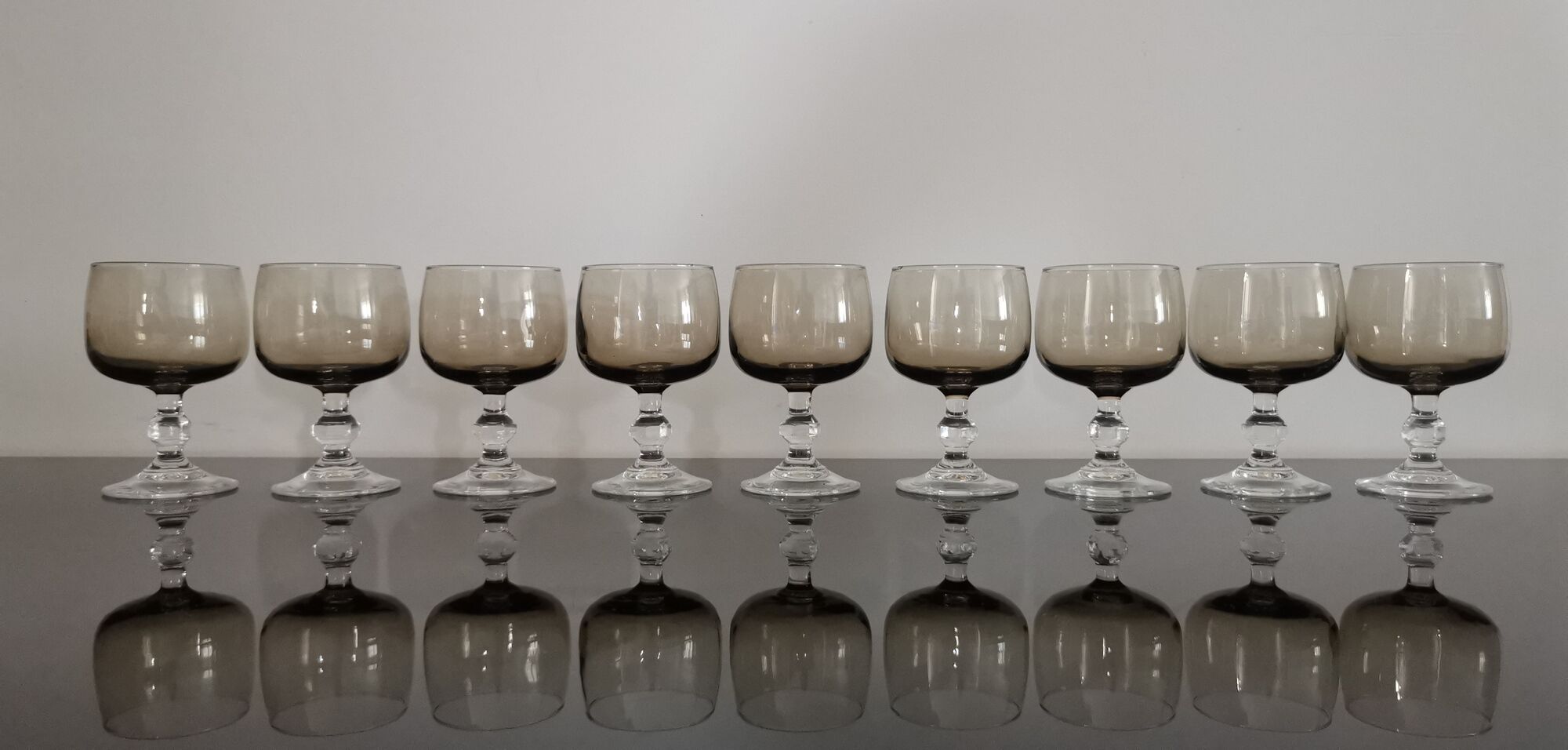 9 glasses of white wine on vintage stand Luminarc Smoked Black