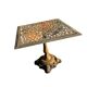 Antique cast iron garden table with decorative openwork top.