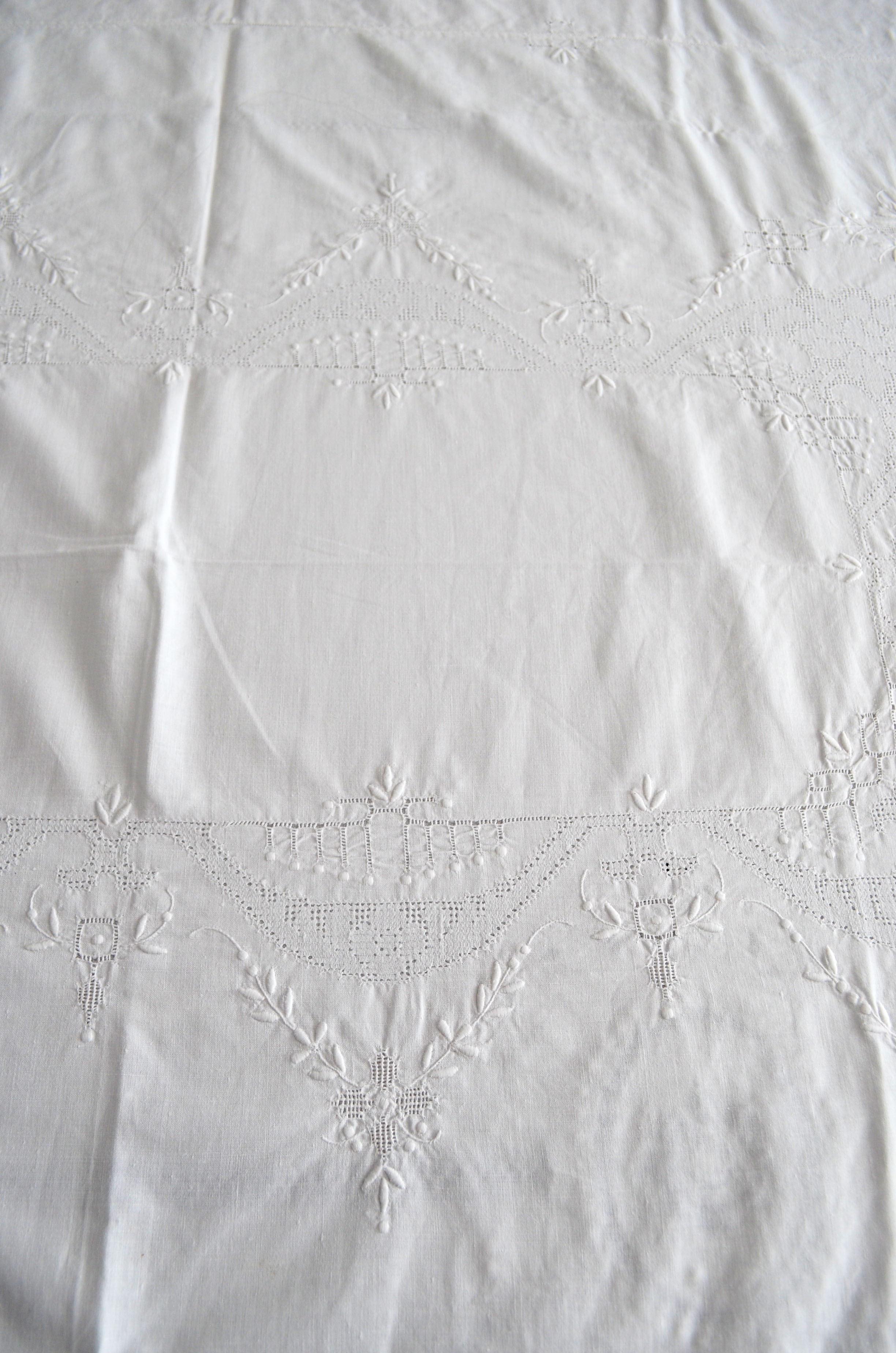 Old white tablecloth embroidered hand