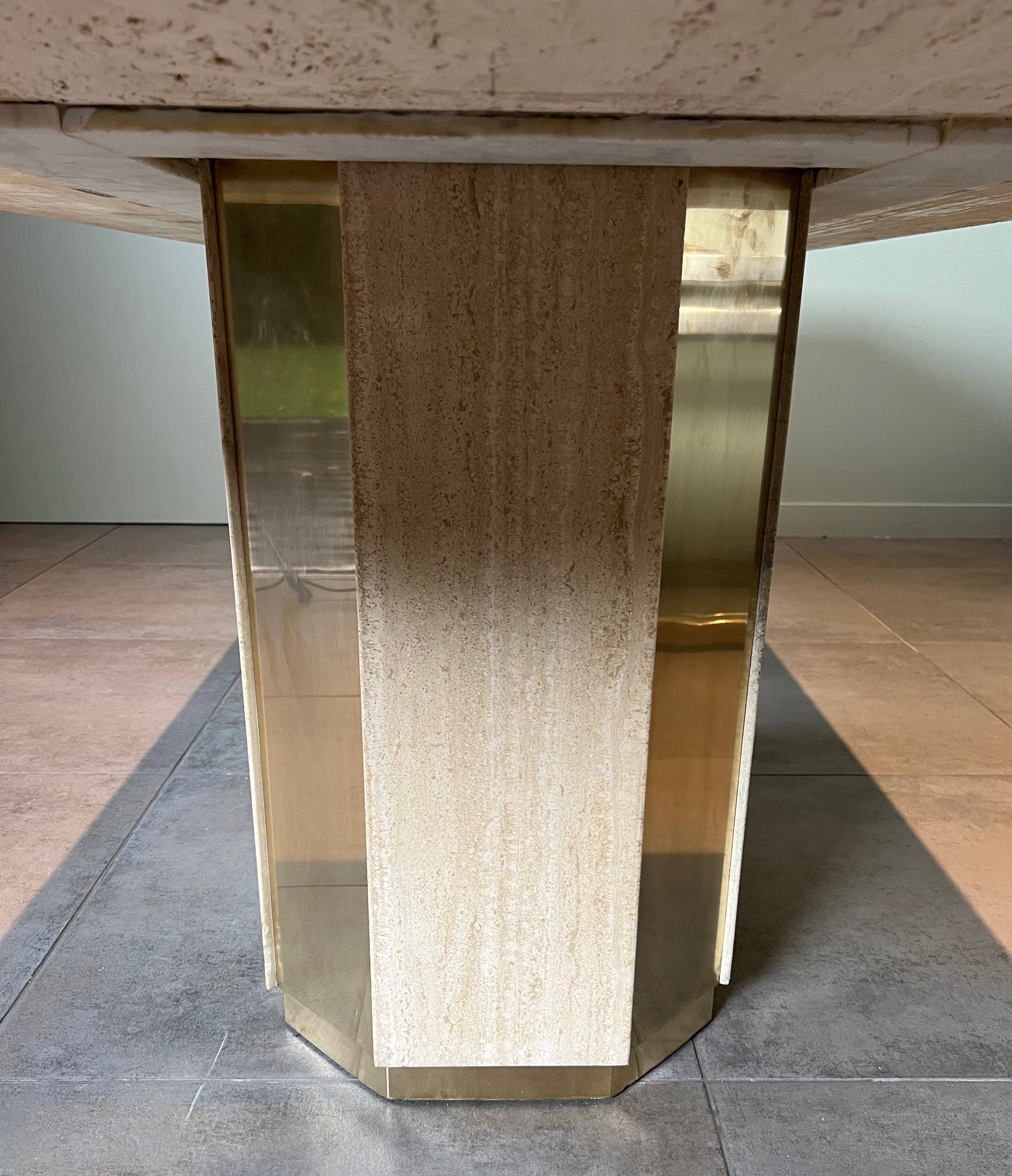 Dining table in travertine and brass. French work. Around 1970.