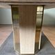 Dining table in travertine and brass. French work. Around 1970.
