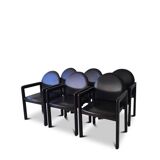Six fauteuils en cuir noir et bois Bulo