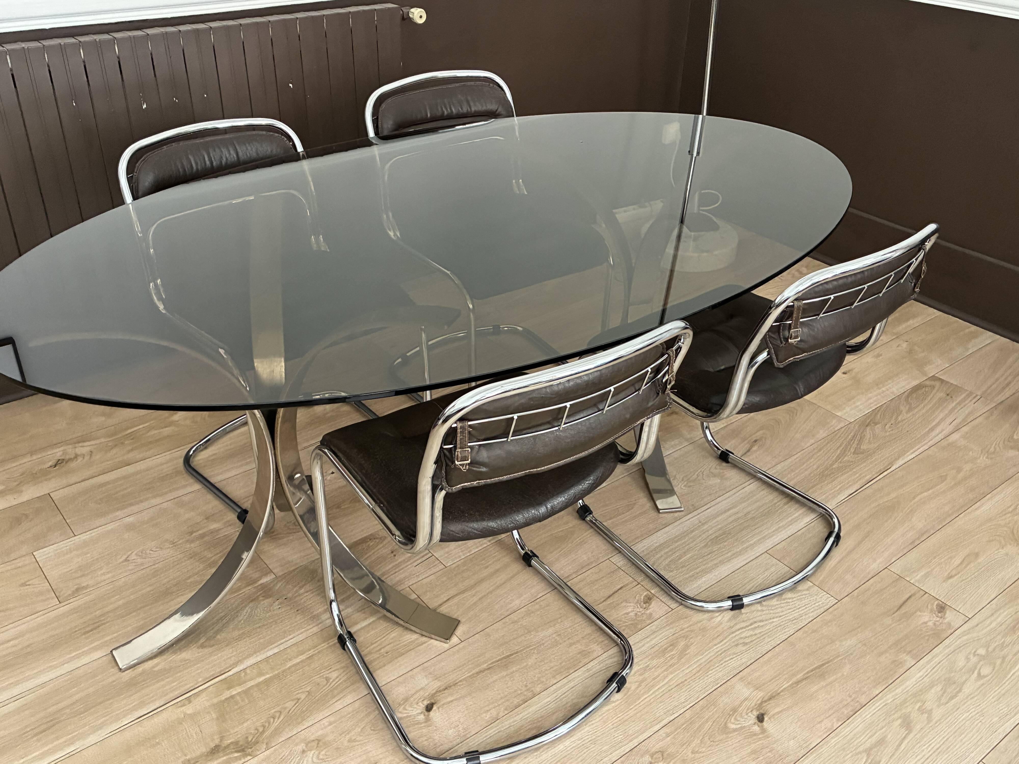 Smoked glass table with a metal base.