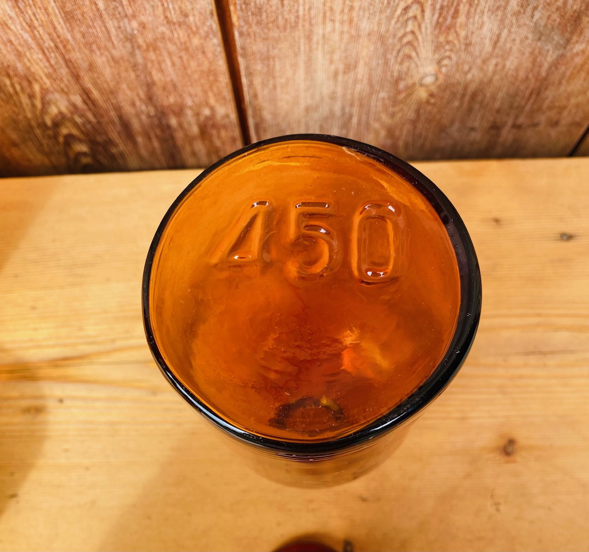 Trio of ancient apothecary bottles of beautiful amber color.