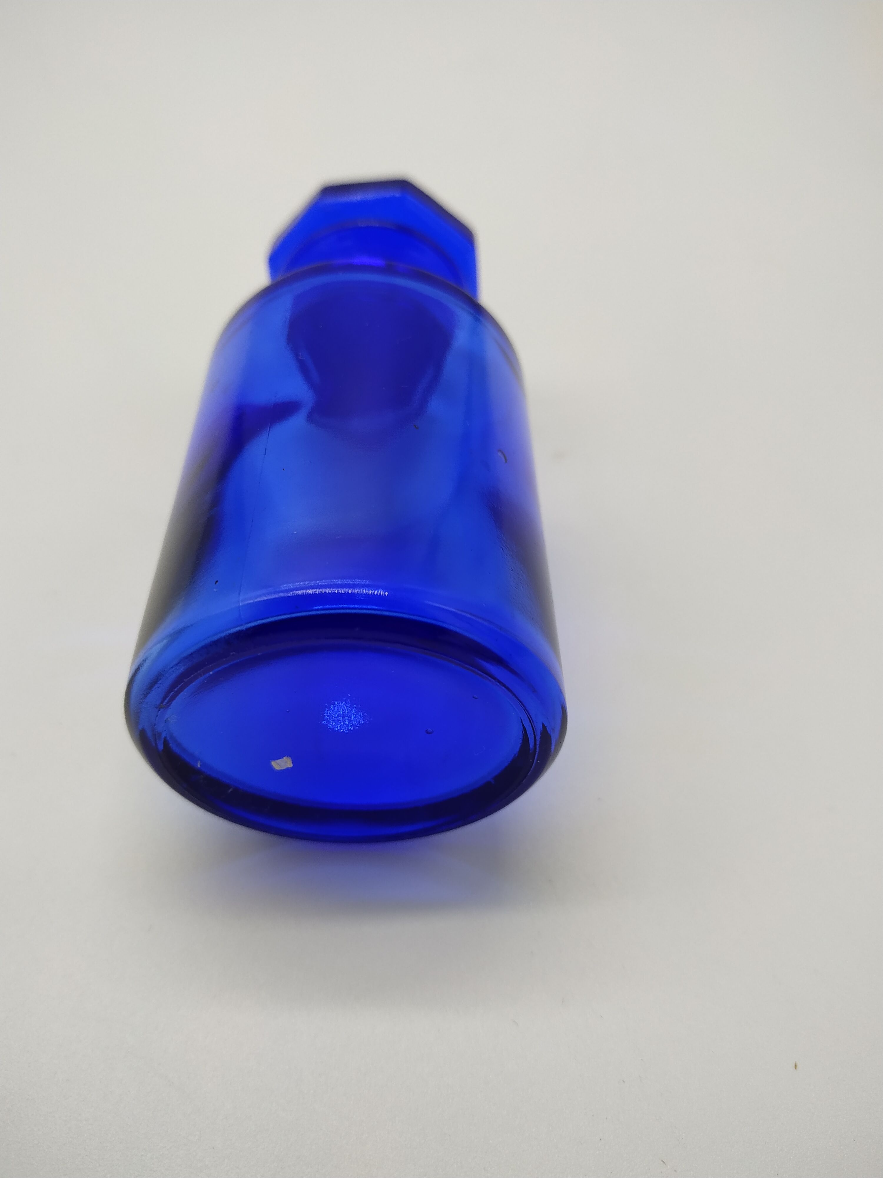 Old perfume bottle in cobalt blue glass