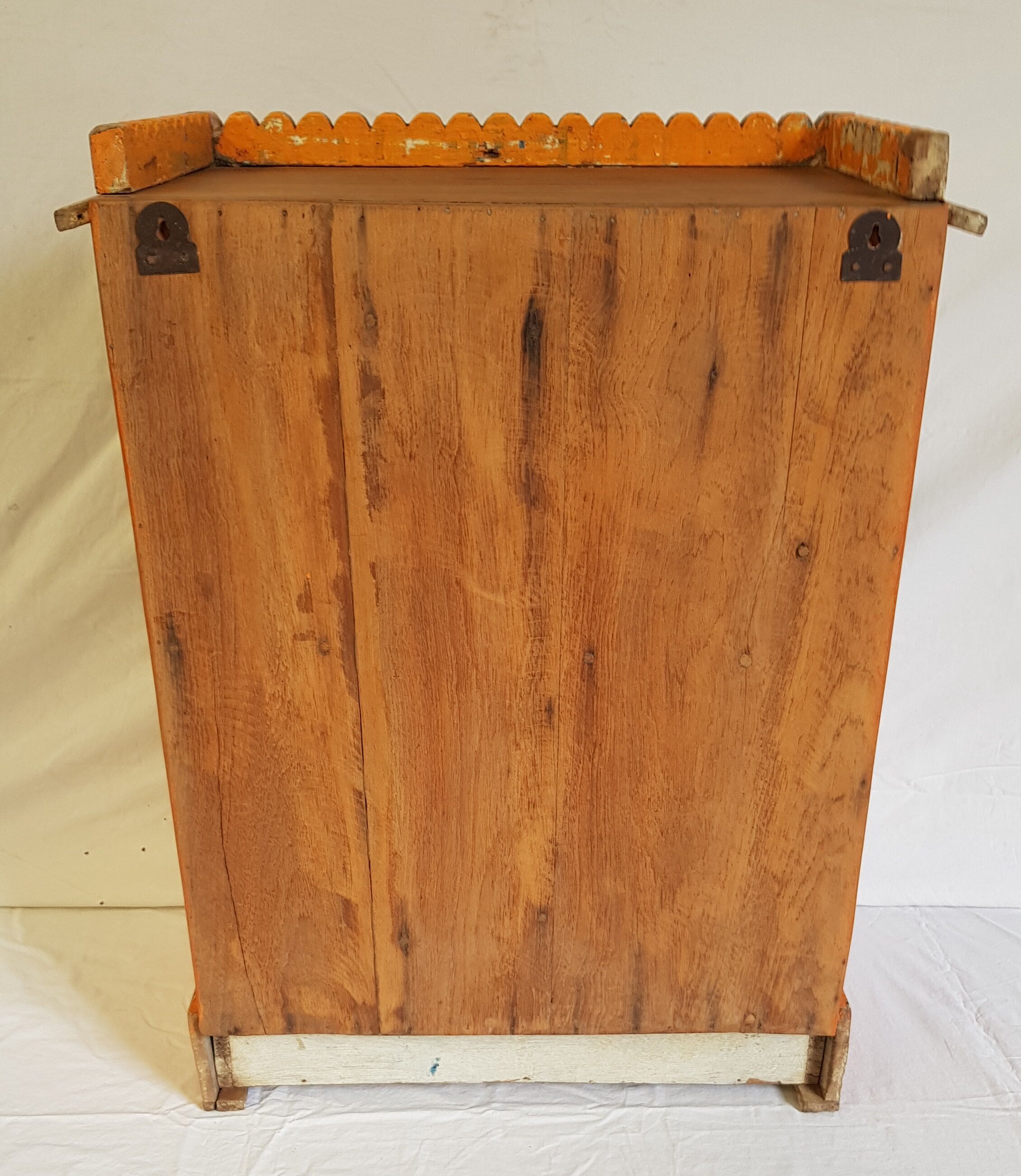 Old temple-showcase with teak offerings