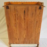 Old temple-showcase with teak offerings