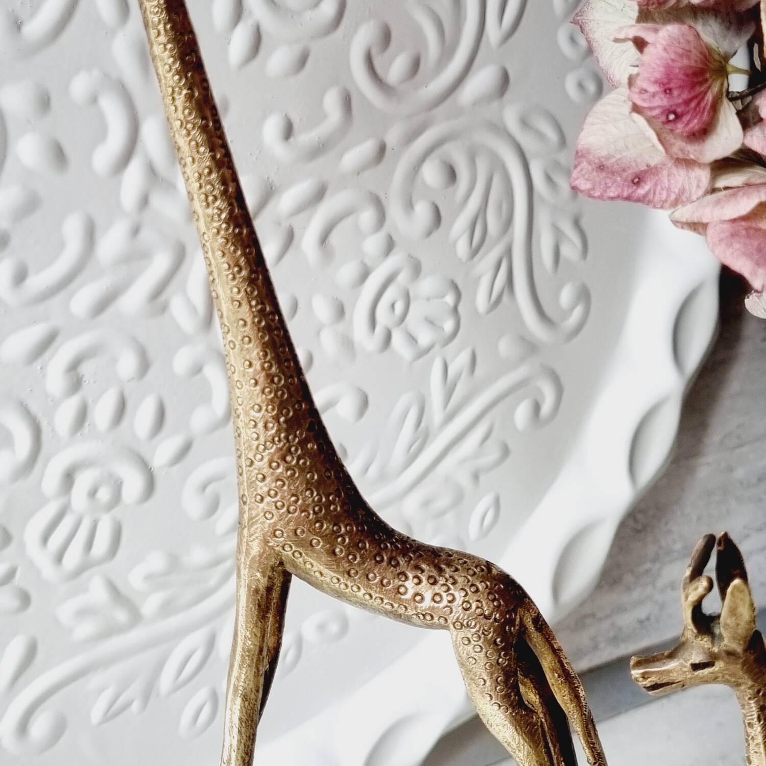 Stylized brass giraffes