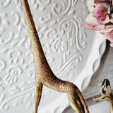 Stylized brass giraffes