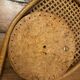 Vintage rattan tennis racket mirror