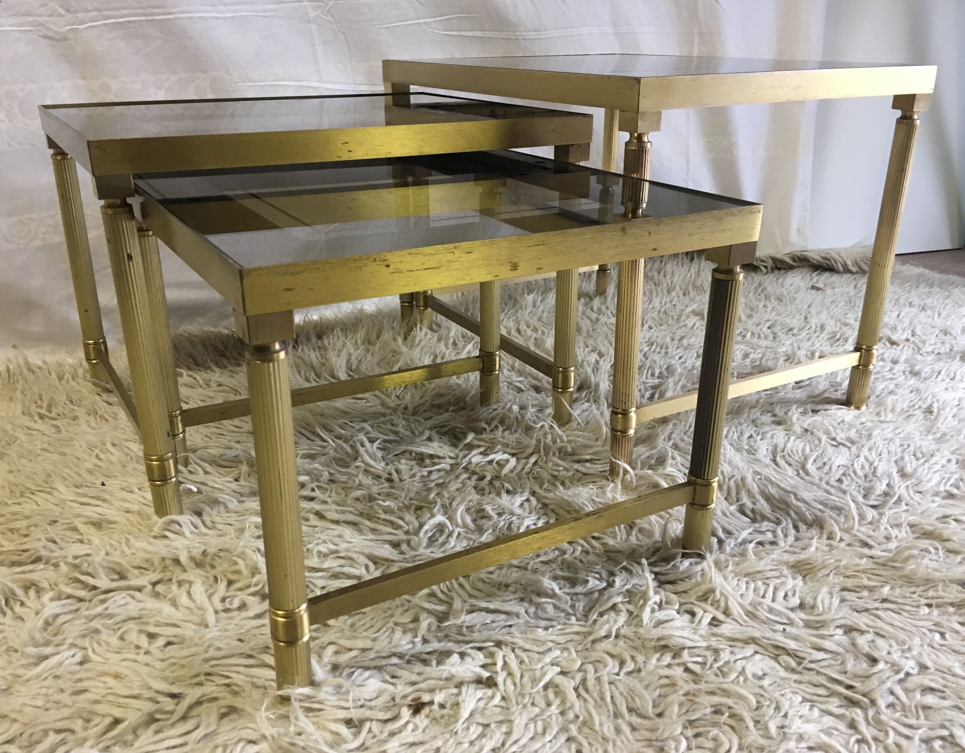Brass and glass pull out tables 70