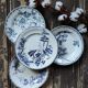 Set of four flat plates in iron earth