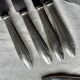 Set of 10 modernist silver-plated metal table knives.