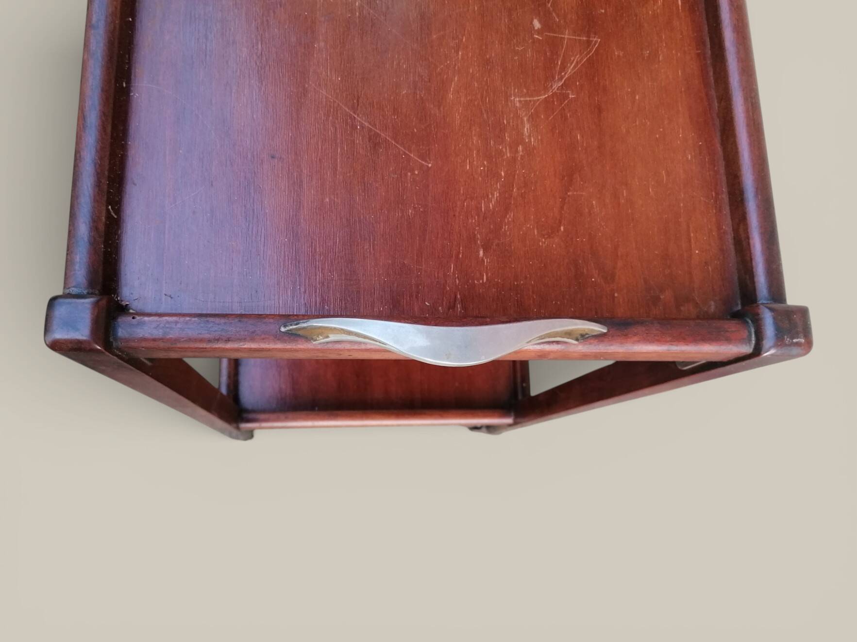 Art Deco wooden serving trolley on wheels.