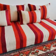 Set of covers for cream and red Moroccan floor sofa.