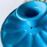 Old enamelled metal candlestick