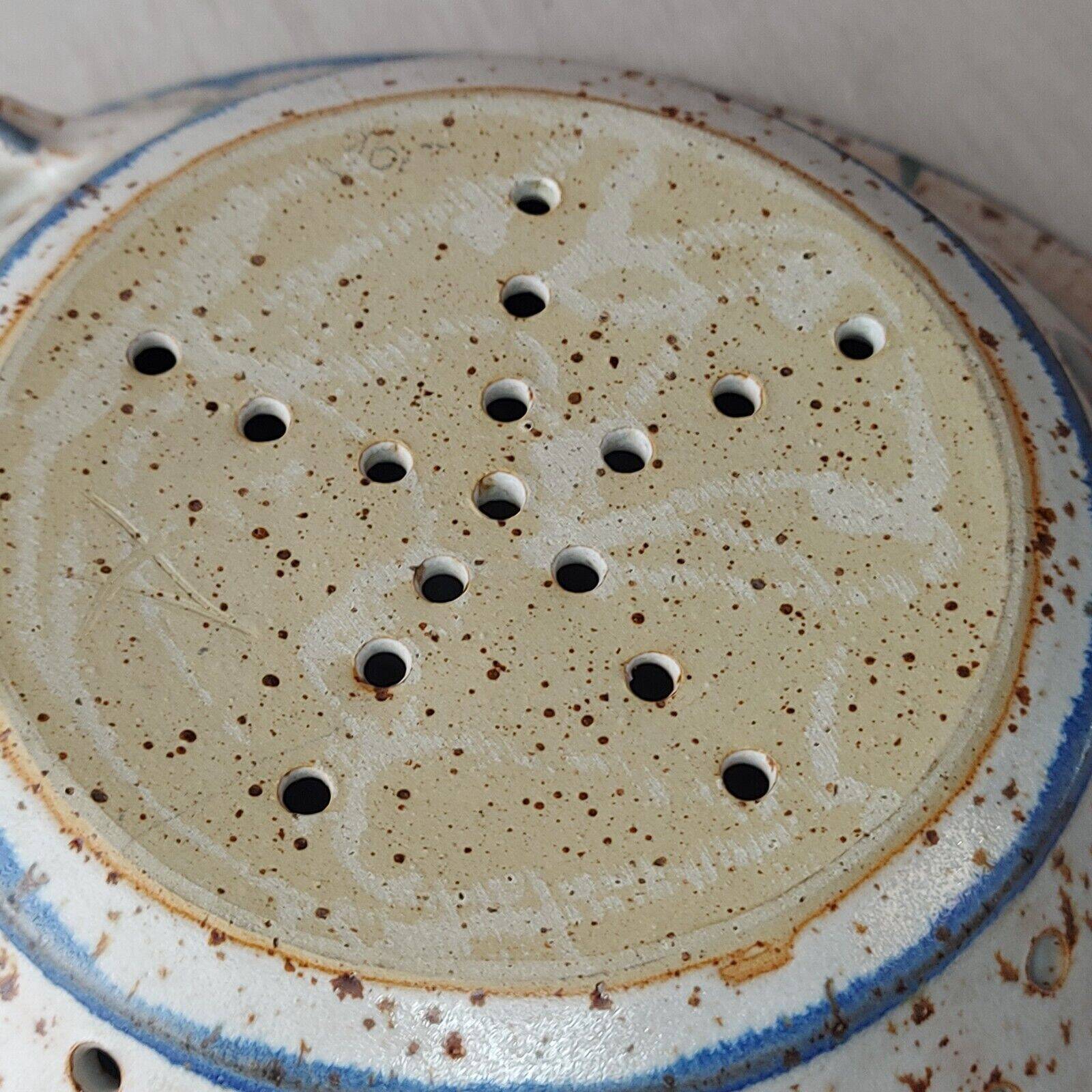 Old stoneware colander
