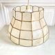 Mother-of-pearl and brass suspension