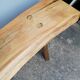 Big bench in solid rough wood very thick Brutalism