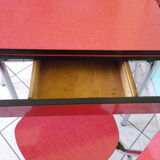 Table in red formica, 4 roc chairs, 2 extension cords, 2 drawers 60