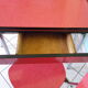 Table in red formica, 4 roc chairs, 2 extension cords, 2 drawers 60