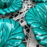 Salad bowl and small bowls in leaf-shaped slipware