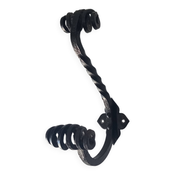 Brutalist wall coat rack in wrought iron.