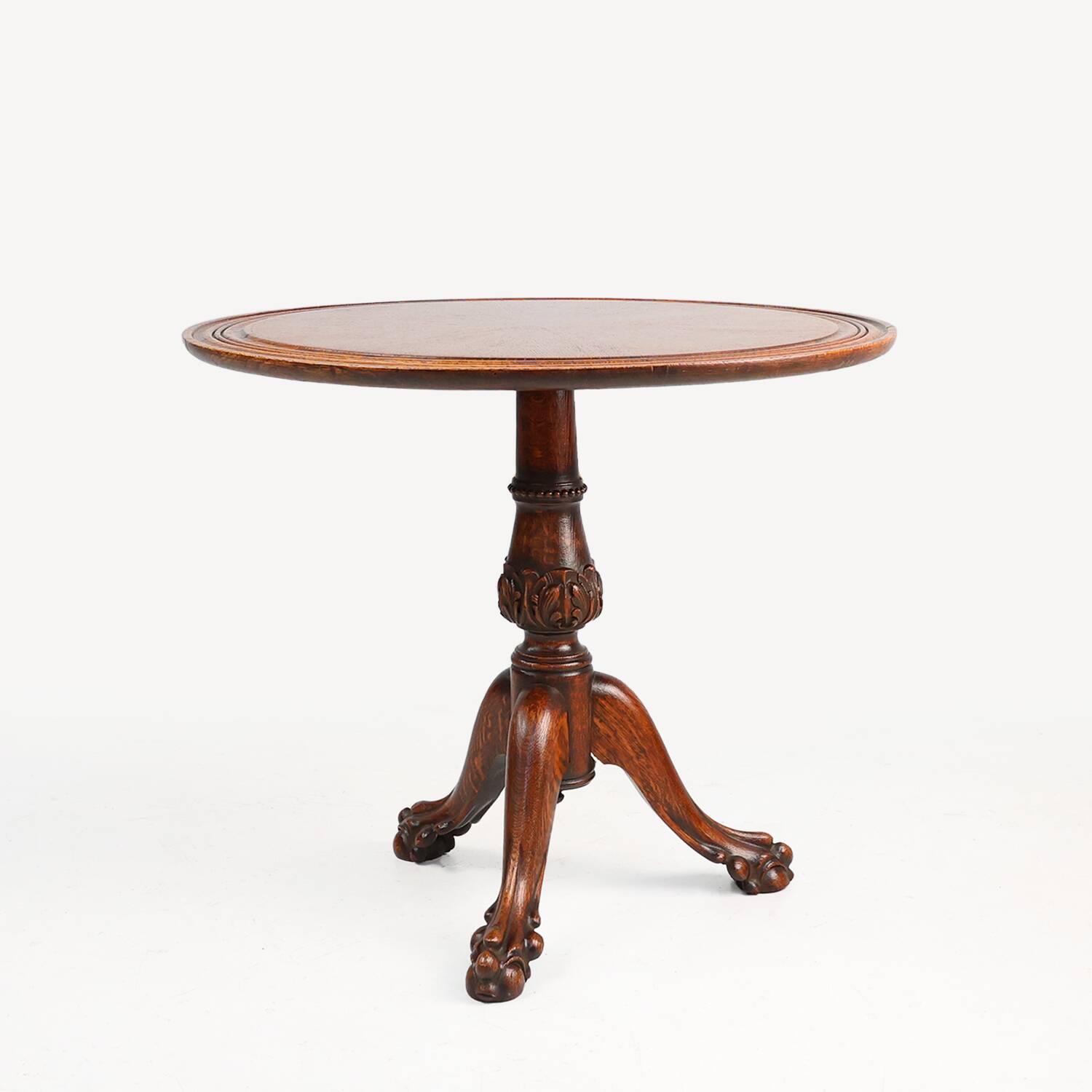 Antique English hand carved circular oak side table with lions head feet