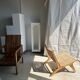 Reclining armchair in natural wood and woven rattan