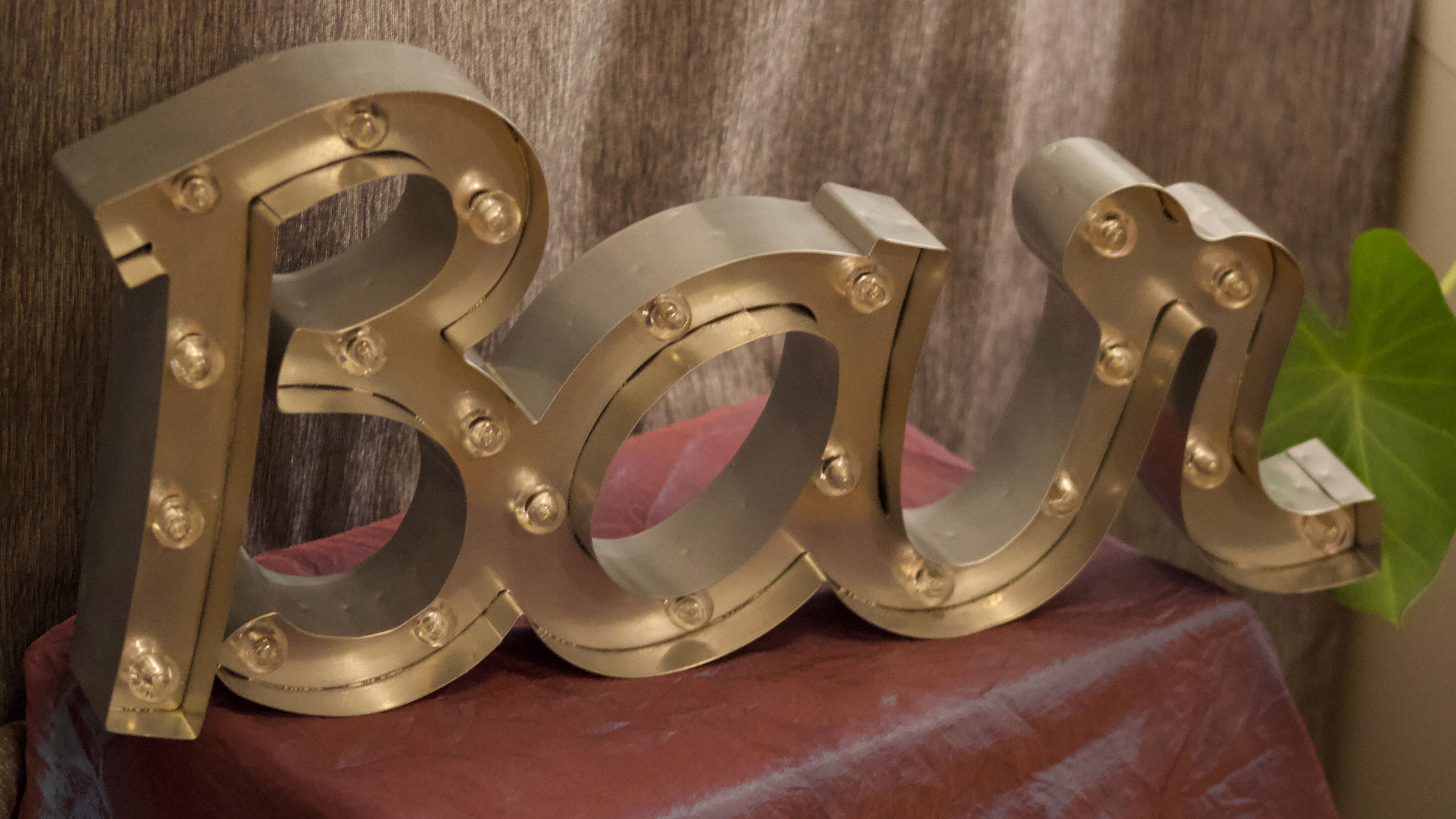 Ancient Light Sign in aluminium lettering forming the word "BAR"