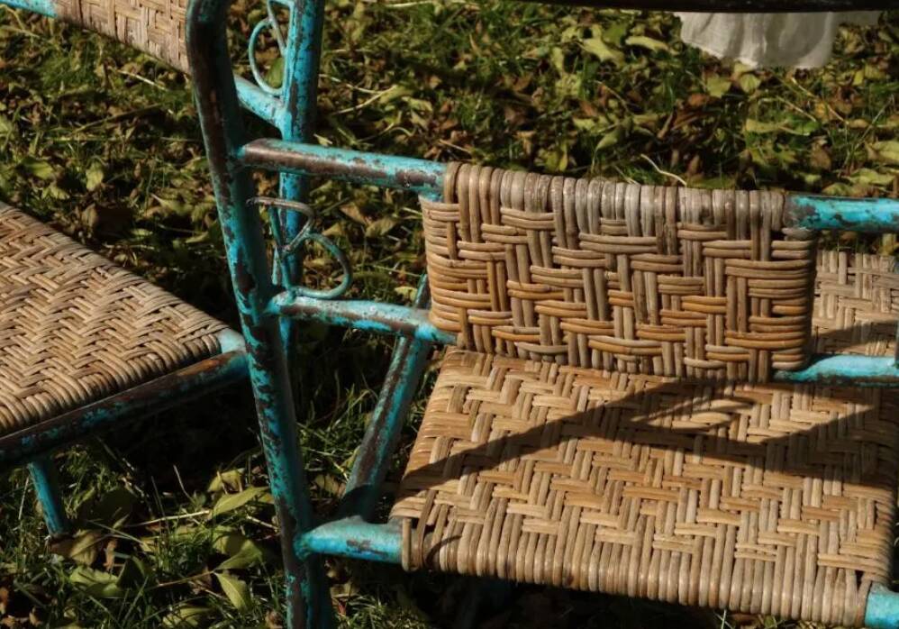Wrought iron and rattan garden chairs