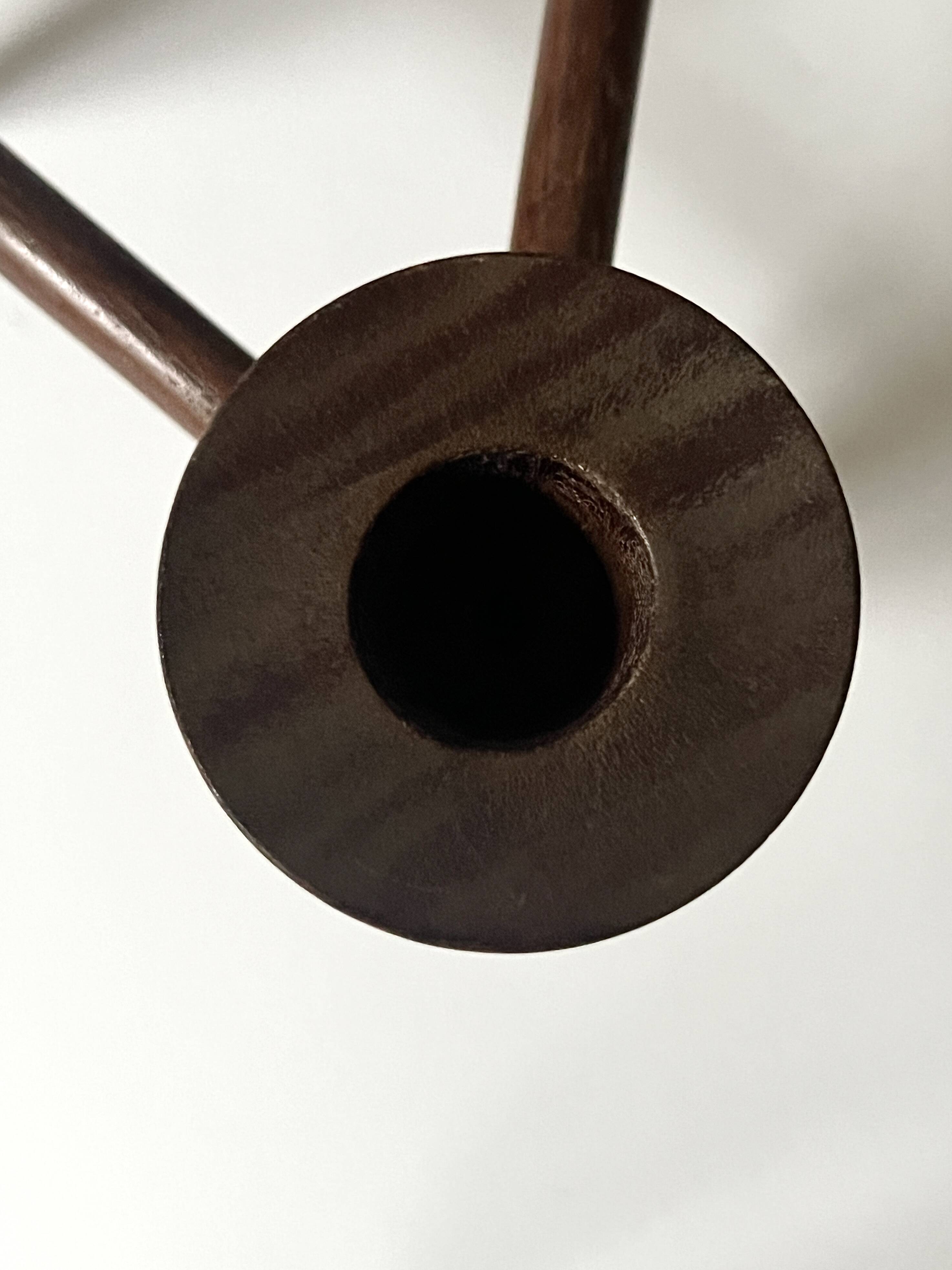 Scandinavian tripod candle holder in carved wood, design from around 1970.