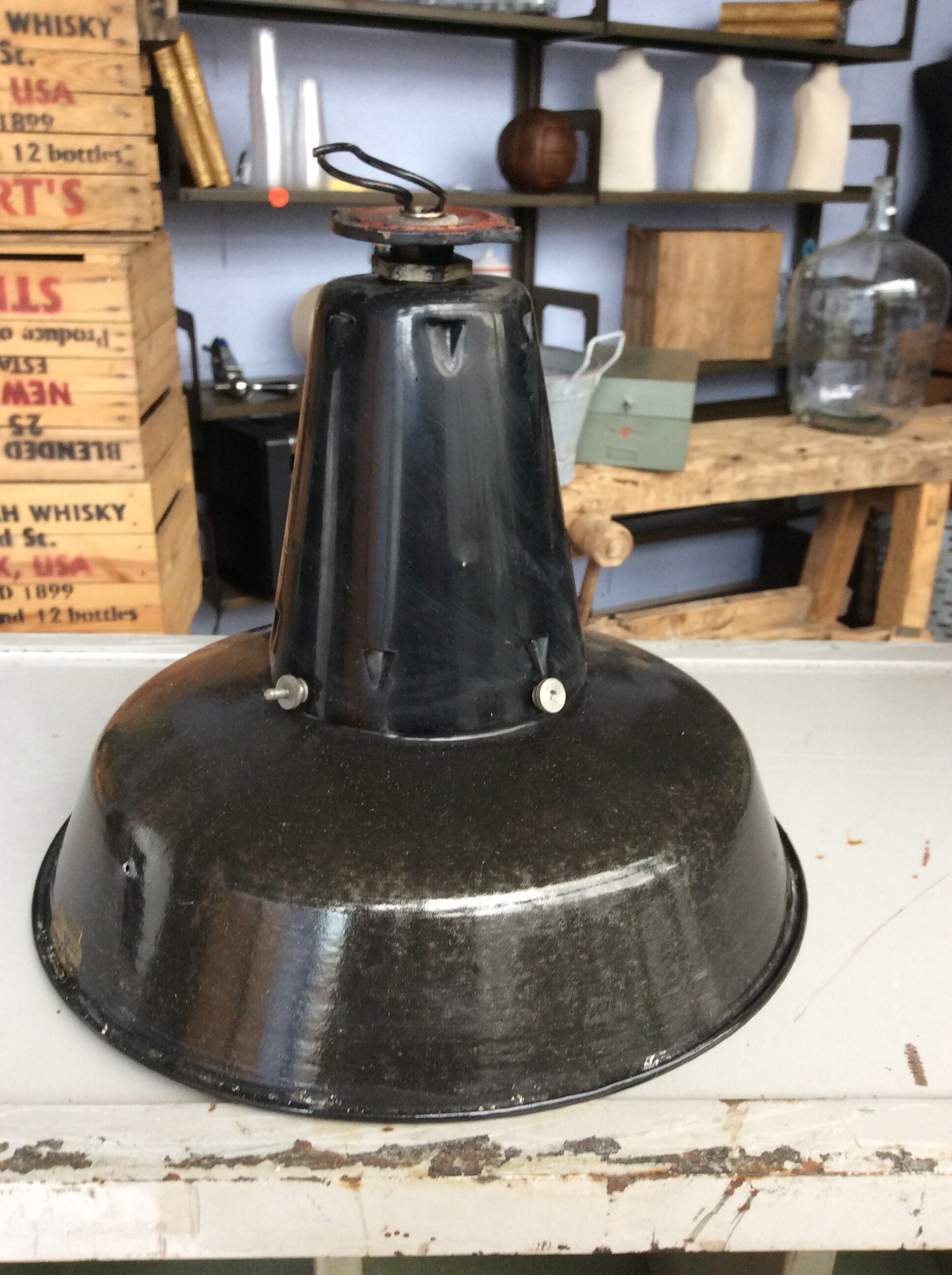 Hanging reflectolux mazda in black enamelled sheet metal.