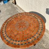 Round garden table in mosaic and iron