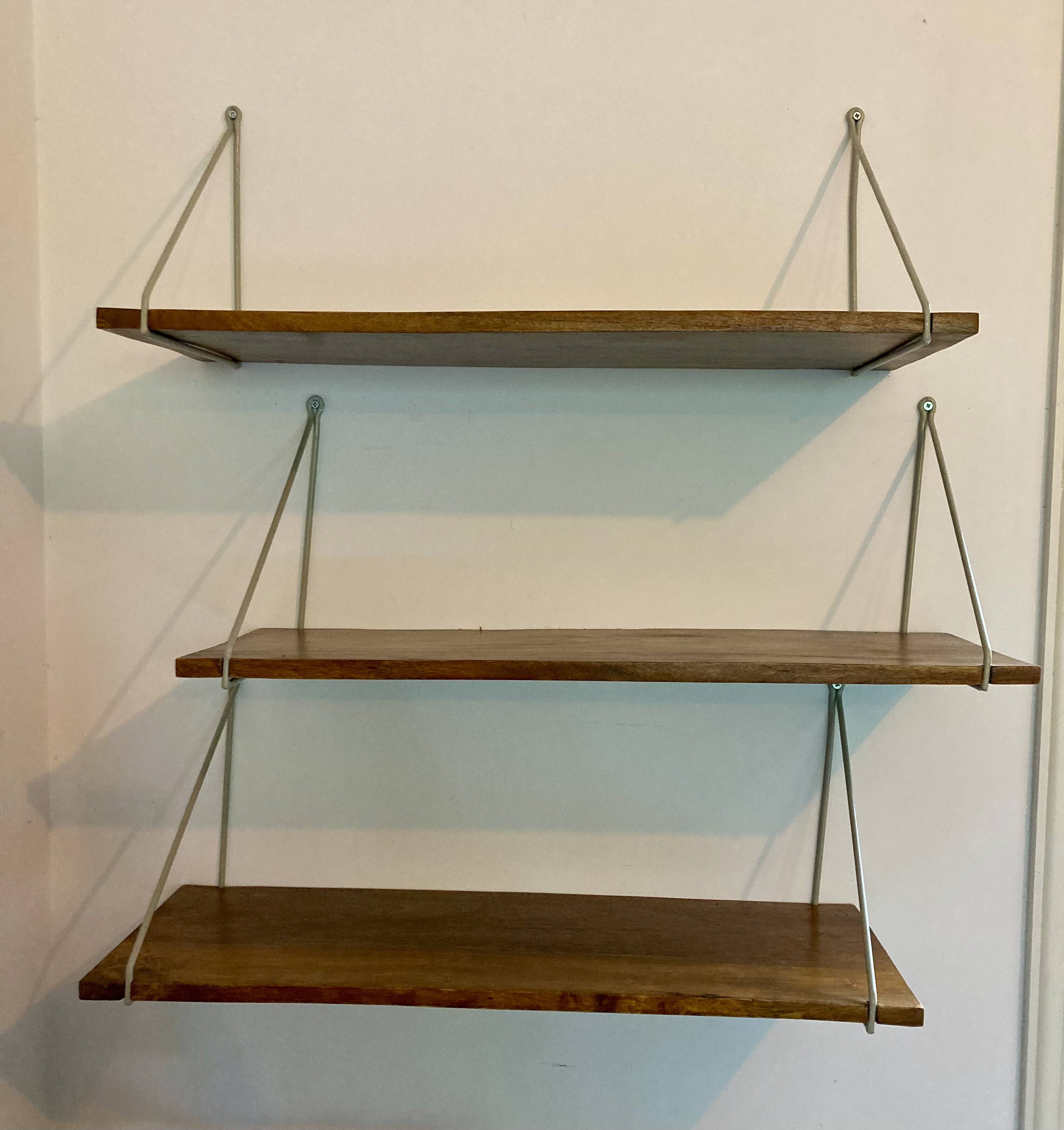 Modular wall shelves in exotic wood