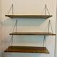 Modular wall shelves in exotic wood