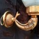 Golden brass wall light with glass tulip - dolphin pattern bathroom lamp