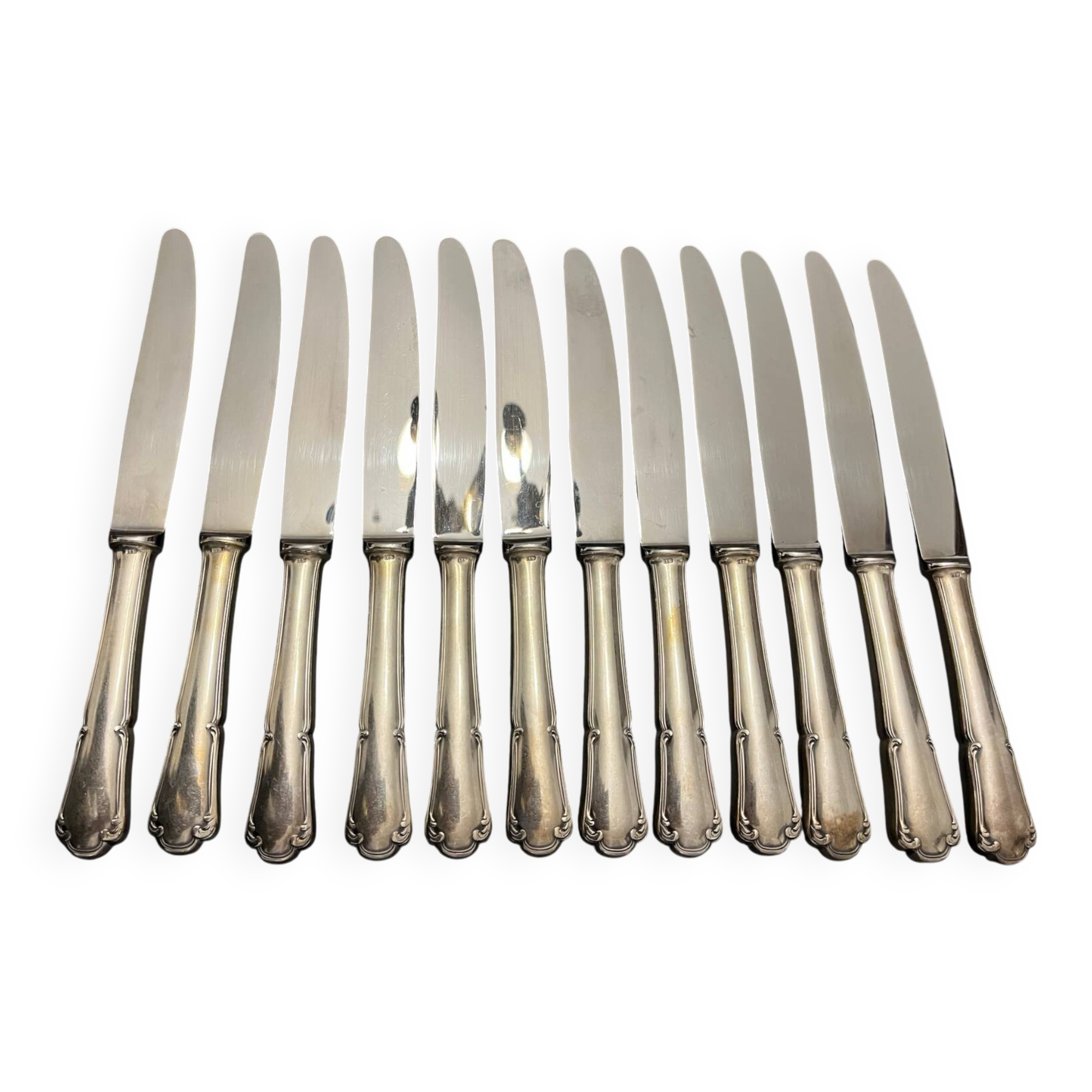 12 silver metal knives