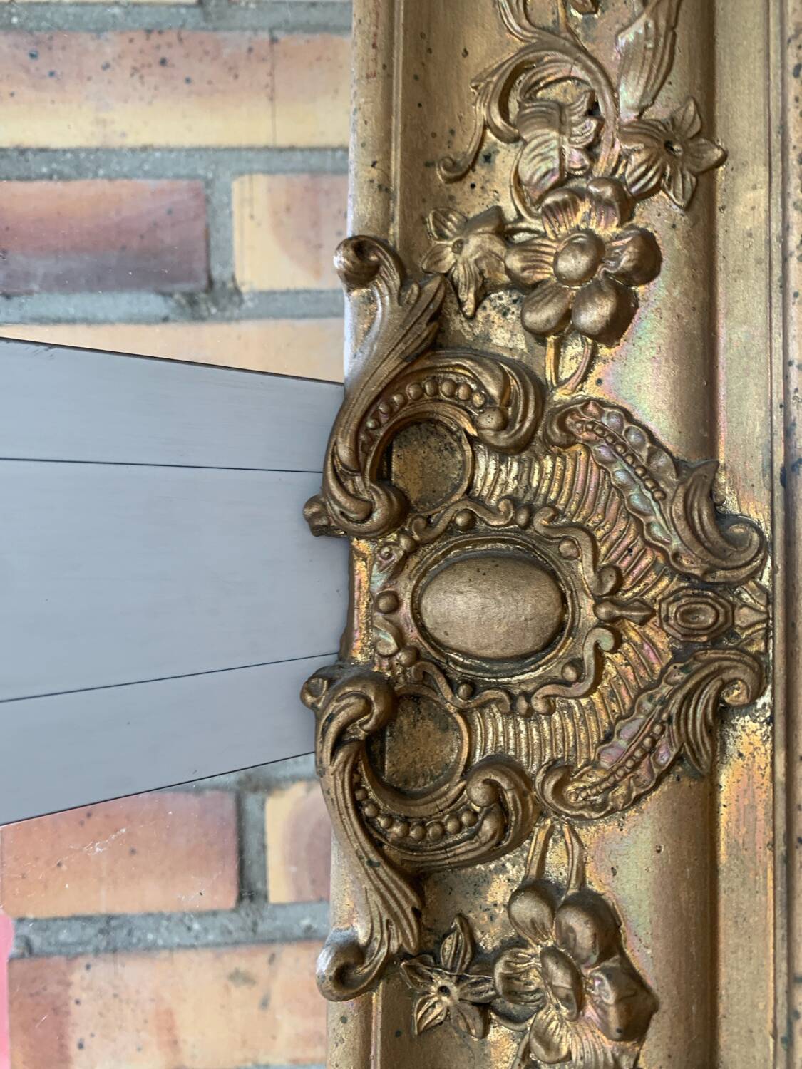 Old gilded mirror fireplace, 19th century restoration