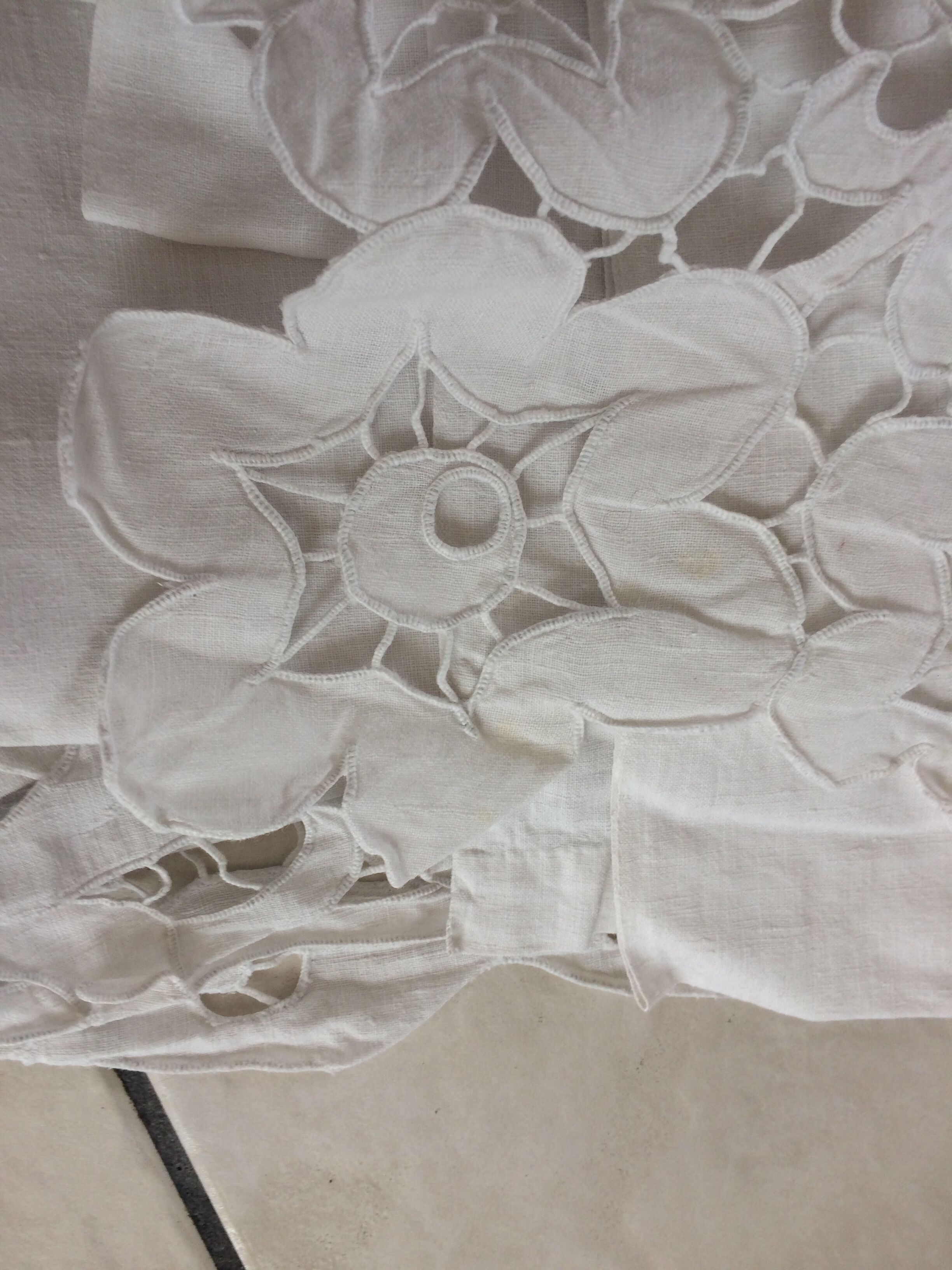 Old sheet with monograms and wide hand made embroider.