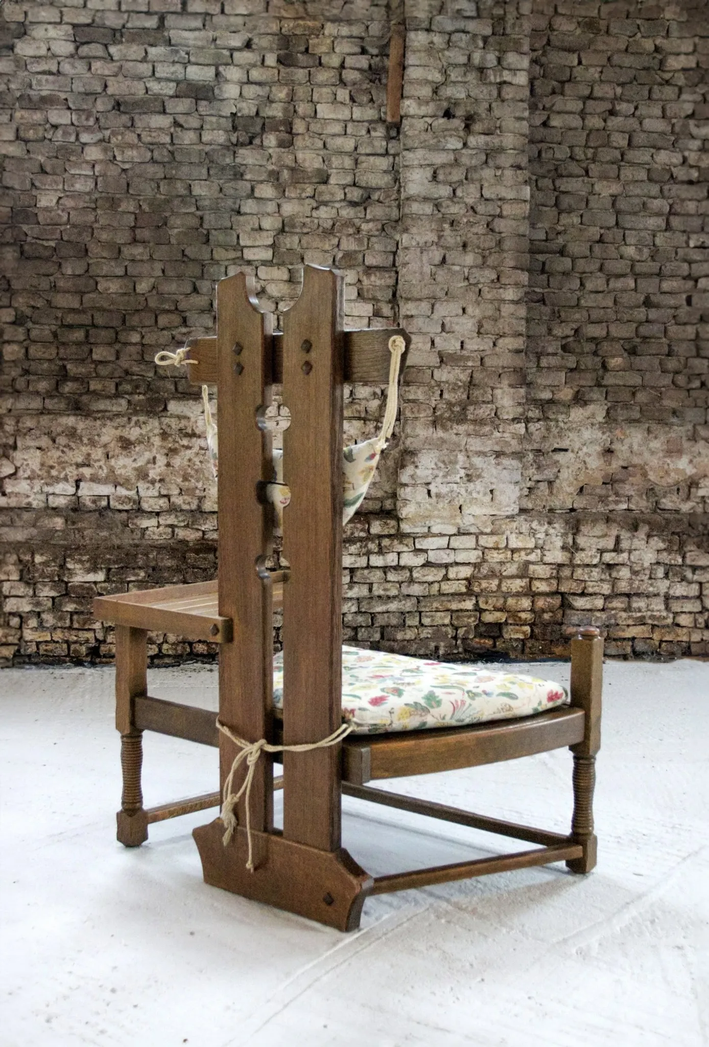 Rare Dutch brutalist oak armchair with integrated side table – 1950s