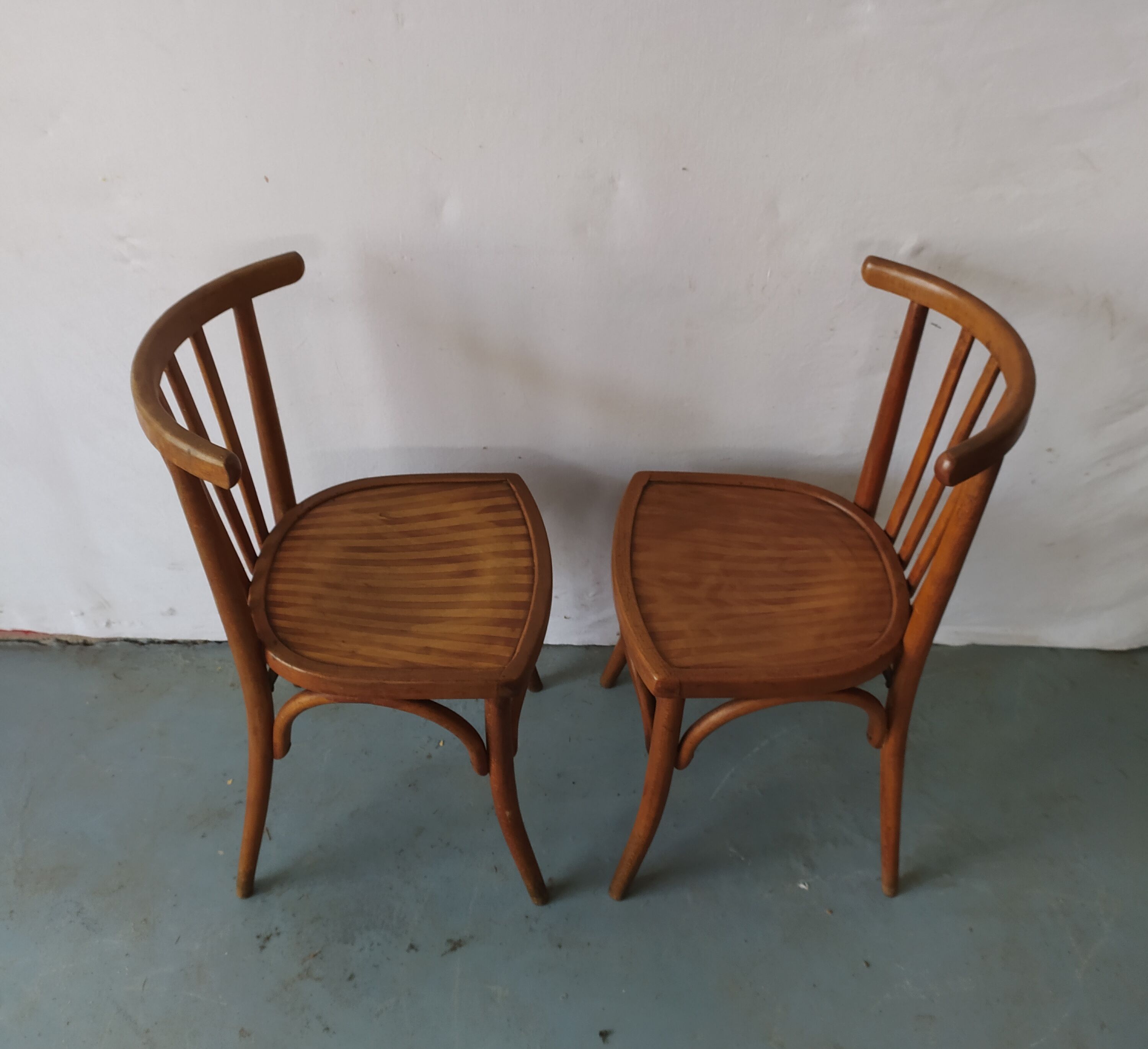 Pair of luterma curved wood bistro chairs