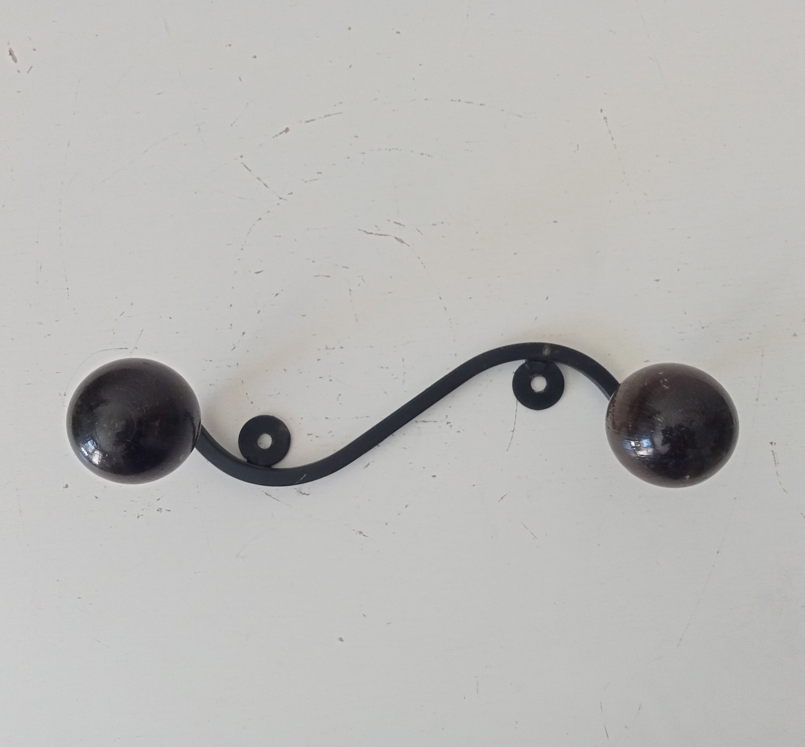 Wood and wrought iron ball coat rack from the 1950s.