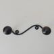 Wood and wrought iron ball coat rack from the 1950s.