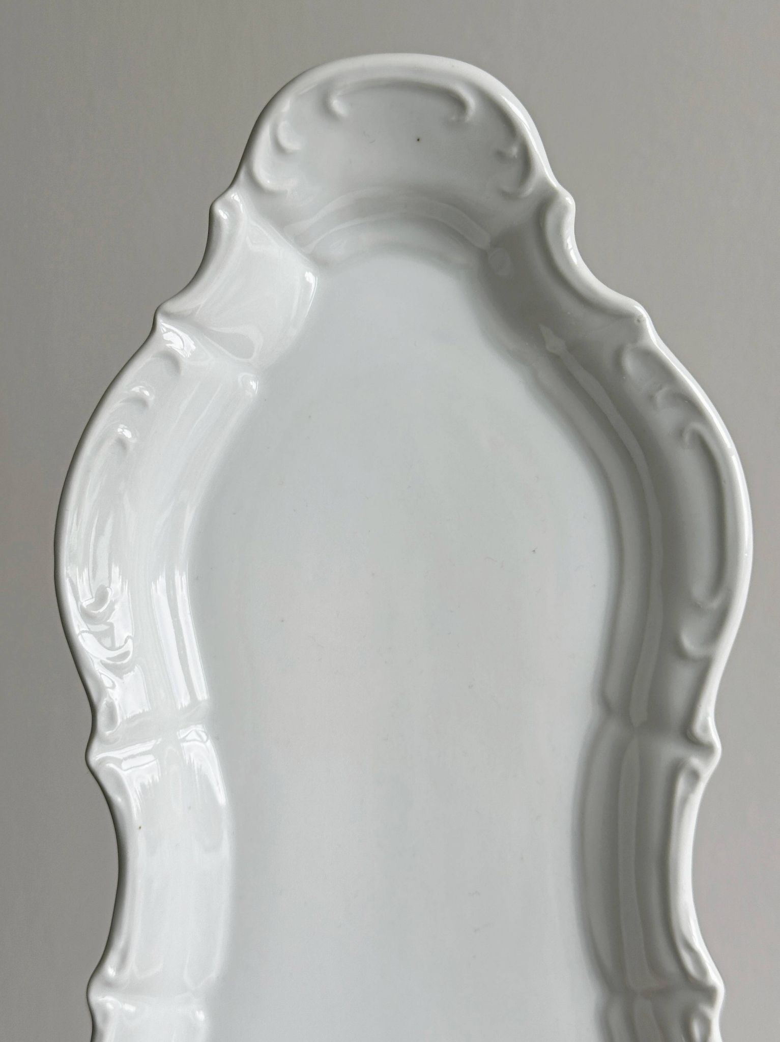 white porcelain plate in an unusual shape
