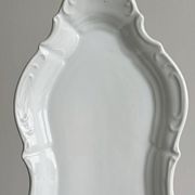white porcelain plate in an unusual shape