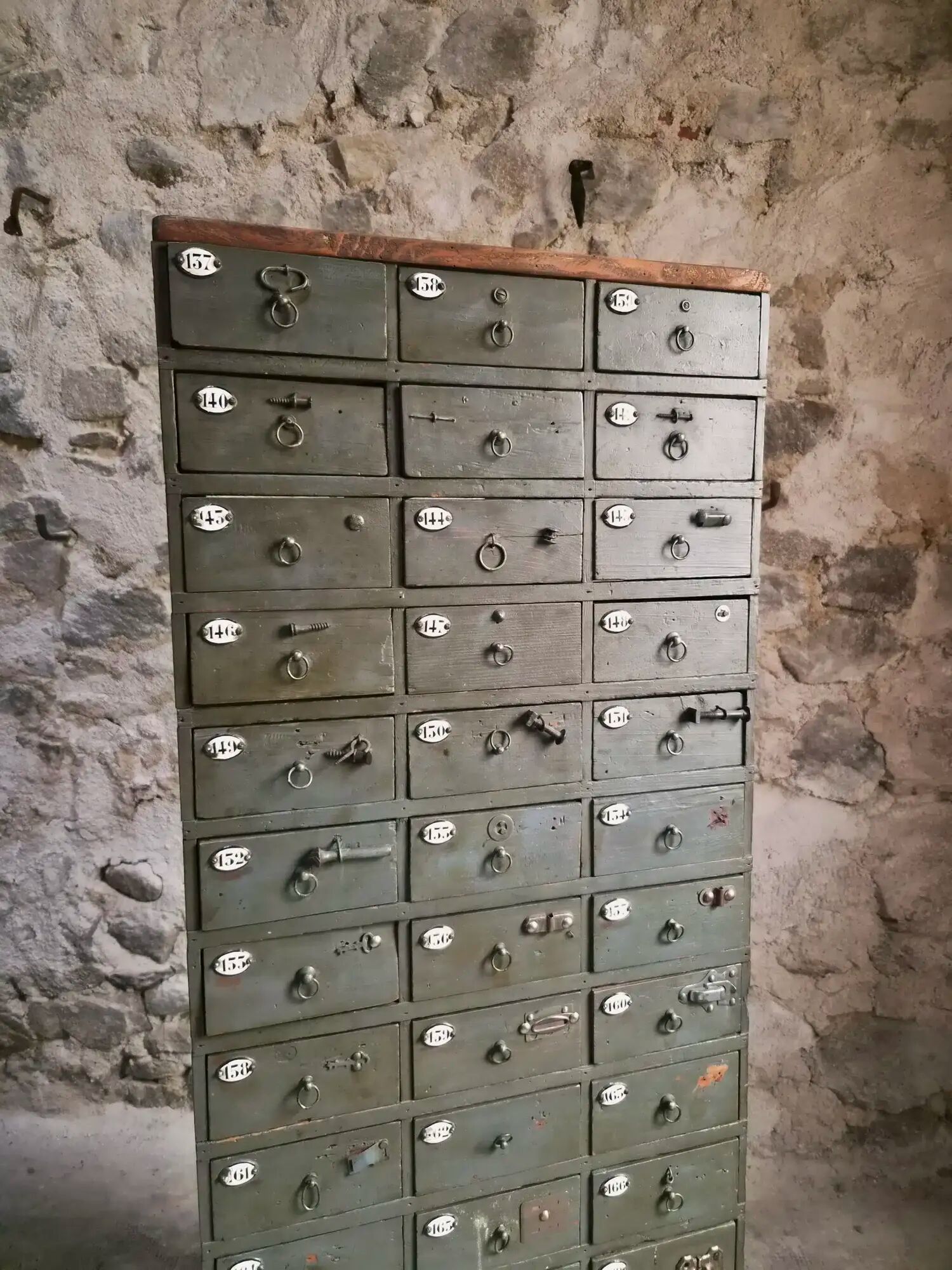 Antique hardware cabinet with 48 drawers, circa 1900.