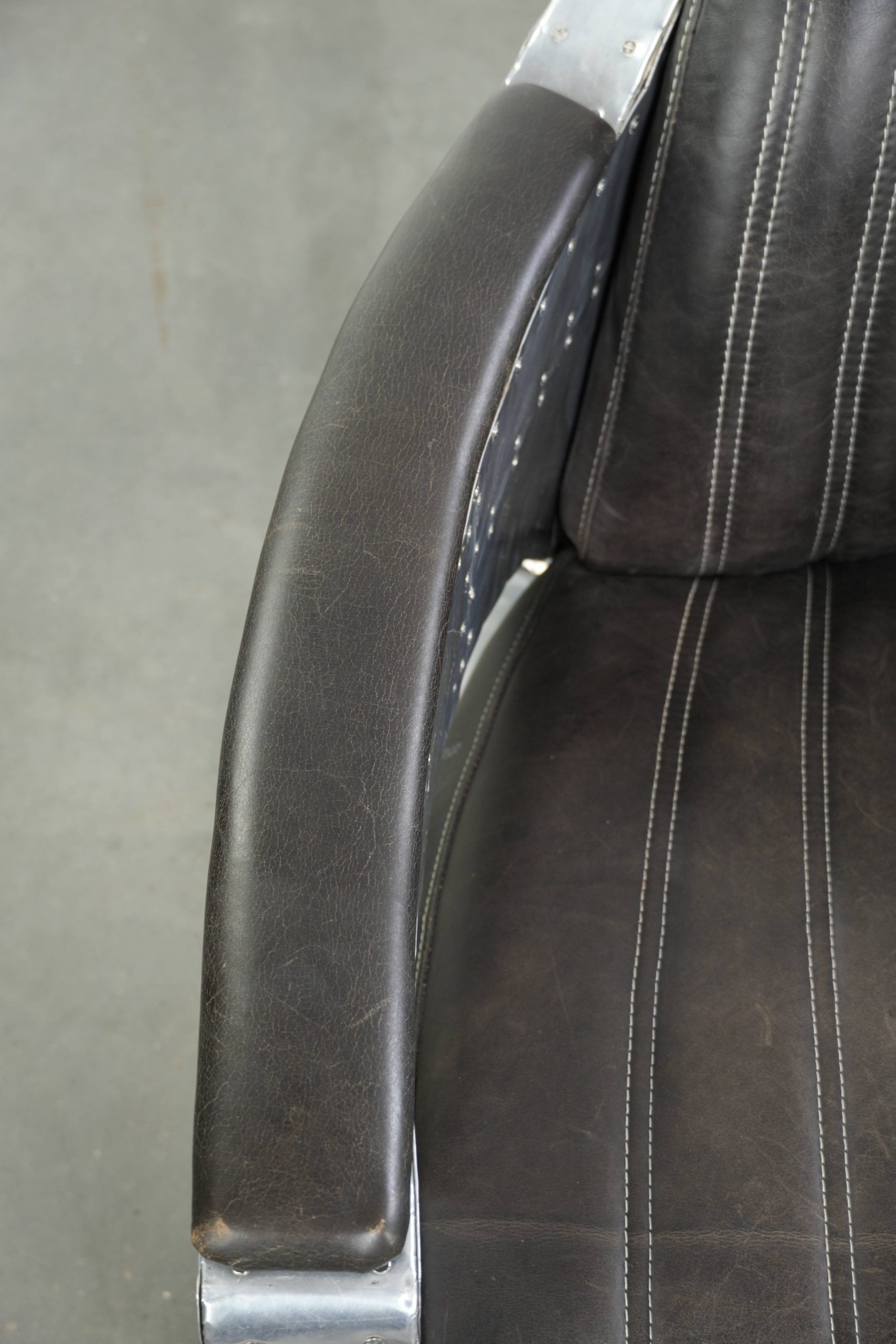 Set of 2 sturdy industrial black cowhide Aviator design armchairs with aluminium and rivets