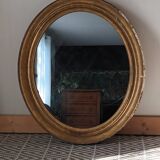 Antique oval gilded stucco mirror