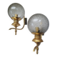 Pair of vintage gold wall sconces with transparent globes
